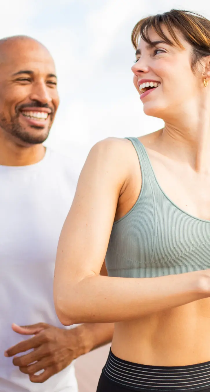 Istock image Total Wellbeing 1-725 A smiling man carrying a smiling woman on his back